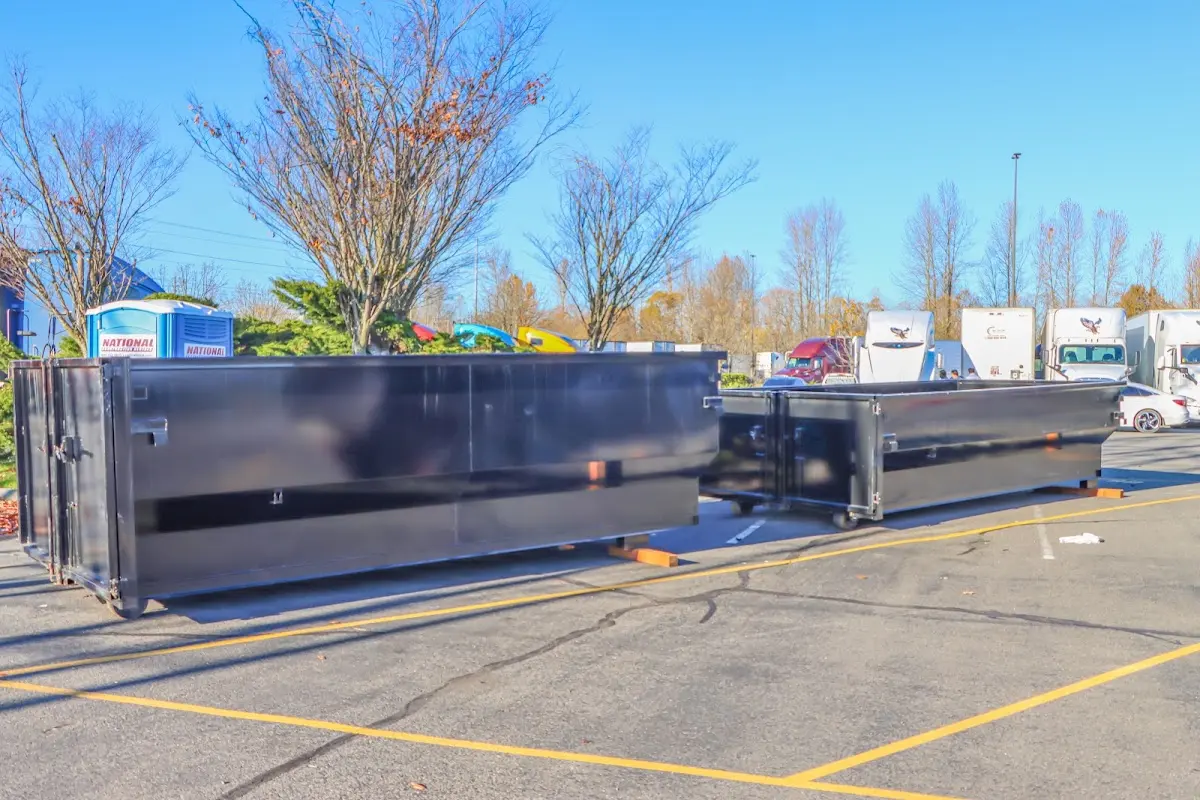 Professional dumpster rental service with roll-off container on residential driveway in Walterboro